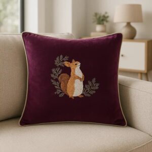 Red squirrel embroidered on a plum coloured velvet Cushion