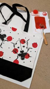 Ladybirds printed on a tote bag created at the Print Your Own Tote Bag Workshop