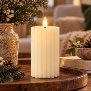 Medium LED Cream Wax Candle on wooden plate in a cosy Livingroom